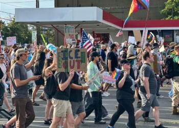 Safety volunteer charged in the fatal shooting of a Utah 'No Kings' protester