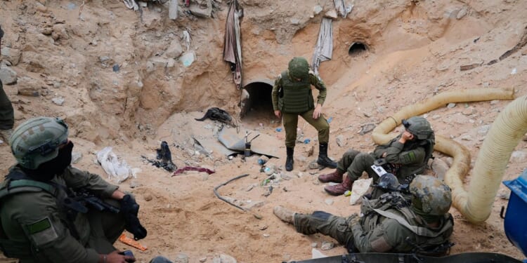 Israel army takes journalists into a tunnel in a Gaza city it seized and largely flattened