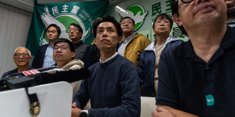 After more than 30 years of activism, Hong Kong's biggest pro-democracy party votes to disband