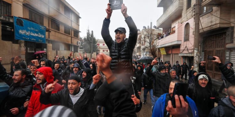 Hundreds mourn in Syria's Homs after mosque bombing