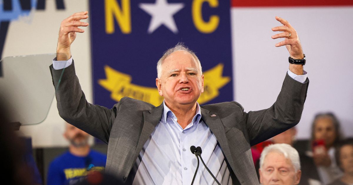 Minnesota Gov. Tim Walz gestures as he speaks during a Get-Out-The-Vote rally with former President Bill Clinton for Vice President Kamala Harris on the first day of North Carolina early voting in Durham, North Carolina, on Oct. 17, 2024.