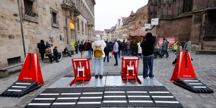 Mobile vehicle mitigation barriers are seen near the Christmas market prior to its official opening in Nuremberg, Germany, on Nov. 28, 2025.