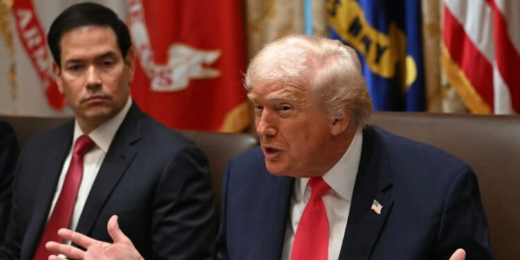 President Donald Trump speaks next to Secretary of State Marco Rubio during a meeting in the Cabinet Room of the White House on Dec. 2, 2025.