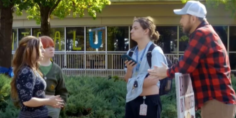 Christian anti-abortion activist T. Russell Hunter engages with college students in a video posted on Dec. 1, 2025.