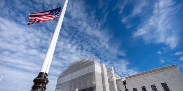 An American flag flies at half-staff outside the Supreme Court on Nov. 5, 2025, in Washington, D.C.