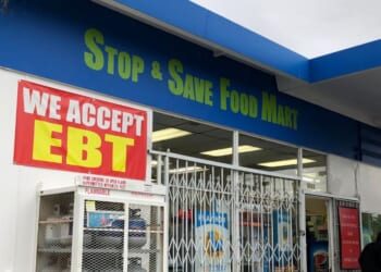 A sign noting the acceptance of EBT cards that are used by state welfare departments to issue benefits is displayed at a convenience store on Dec. 4, 2019, in Richmond, California.