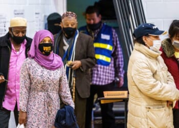 Somali-American voters cast their ballots at Brian Coyle Community Center in Minneapolis, Minnesota, on Nov. 3, 2020.