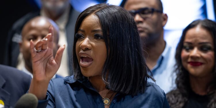 Rep. Jasmine Crockett (D-TX) speaks to reporters at a news conference in Warrenville, Illinois, on Aug. 4, 2025.
