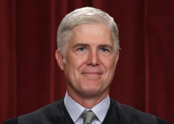 United States Supreme Court Associate Justice Neil Gorsuch poses for an official portrait in the Supreme Court building in Washington, DC on Oct. 7, 2022.
