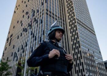 An NYPD Strategic Response Group officer stands guard outside of 26 Federal Plaza on Oct. 21, 2025, in New York City.