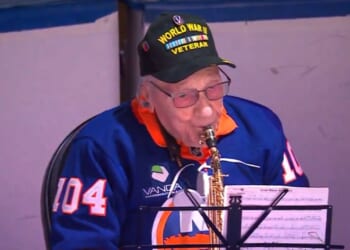 World War II veteran Dominick Critelli, 104, brought cheers from the crowd with his rendition of "The Star-Spangled Banner."