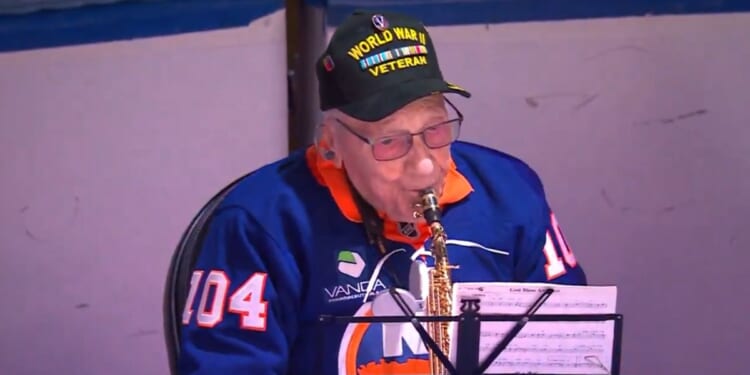 World War II veteran Dominick Critelli, 104, brought cheers from the crowd with his rendition of "The Star-Spangled Banner."