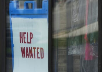 "Help Wanted" sign is displayed at a dry cleaner in Rolling Meadows, Illinois, on May 15, 2025.