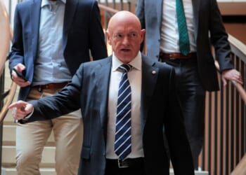 Sen. Mark Kelly arrives for a closed door meeting on Capitol Hill on Dec. 16, 2025, in Washington, D.C.