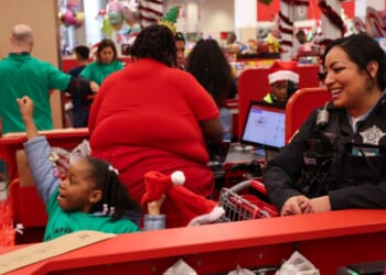 A Chicago Police officer participates in "Shop with a Cop," as shown in a post from the Chicago Police Department on Dec. 11, 2025.
