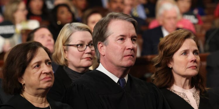 Supreme Court Justice Elena Kagan, United States Chief Justice John Roberts, and Supreme Court Justice Amy Coney Barrett listen to President Donald Trump speak during an address to a joint session of Congress at the U.S. Capitol in Washington, D.C., on March 4, 2025.