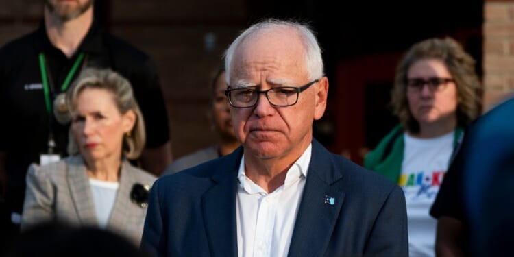 Minnesota Gov. Tim Walz speaks to media outside Deerwood Elementary in Eagan, Minnesota, on Sept. 2, 2025.
