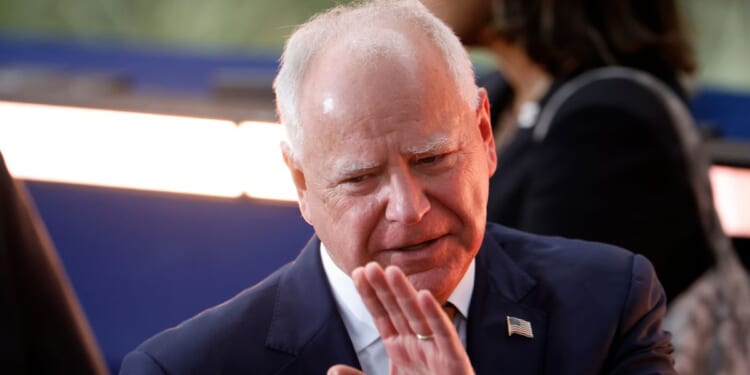 Then-Democratic vice presidential nominee, Minnesota Gov. Tim Walz reacts as Democratic presidential nominee, U.S. Vice President Kamala Harris concedes the election during a speech at Howard University on November 6, 2024 in Washington, DC.