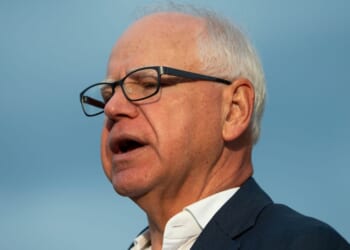 Minnesota Gov. Tim Walz speaks to media gathered on the first day of school at Deerwood Elementary on Sept. 2, 2025, in Eagan, Minnesota.