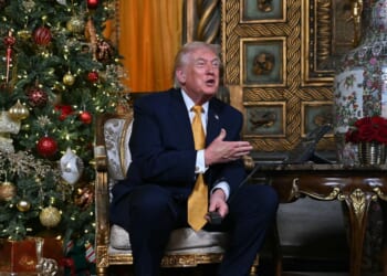 President Donald Trump answers phone calls on Christmas Eve as he participates in the NORAD Santa tracker from the Mar-a-lago club in Palm Beach, Florida, on Dec. 24, 2025.