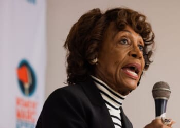 Rep. Maxine Waters speaks to a crowd of volunteers before a phone banking event for Prop 50 at the Women's March Foundation Office on Oct. 23, 2025, in Los Angeles, California.