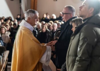 A mother says goodbye to her son as Swiss community grieves after deadly fire