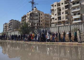 After days of violent clashes, Kurdish fighters evacuated from Aleppo