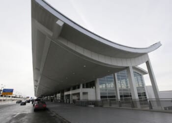 Car crashes through terminal entrance at Detroit airport, injuring 6