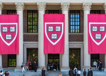 Three huge “Veritas” Banners hang from the facade of Widener Memorial Library at Harvard University.