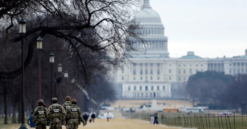 National Guard patrol the Washington Mall, with the U.S. Capitol in the background, on Jan. 9, 2026, in Washington, D.C.