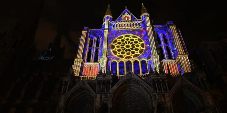 This photograph shows the illuminated Notre-Dame Cathedral in Charles on Christmas Eve, Dec. 24, 2025 in north-central France.