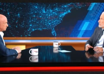 Sen. Mark Kelly, left, went quiet when host Jon Stewart brought up the Obama administration's "extrajudicial killings."