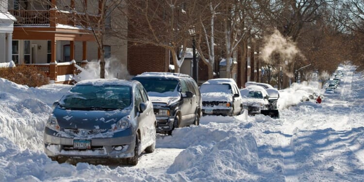 Snow covers a street in Minneapolis, Minnesota after a blizzard on Dec. 12, 2010.