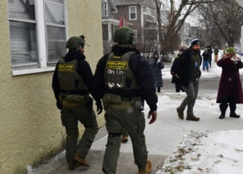 Federal agents patrol a neighborhood in St. Paul, Minnesota, on Jan. 16, 2026.
