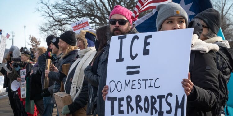 Demonstrators protest outside of the Bishop Henry Whipple Federal Building on Jan. 9, 2026, in Minneapolis, Minnesota.