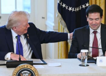 President Donald Trump speaks with Secretary of State Marco Rubio during a meeting with American oil executives in the East Room of the White House in Washington, DC on Jan. 9, 2026.