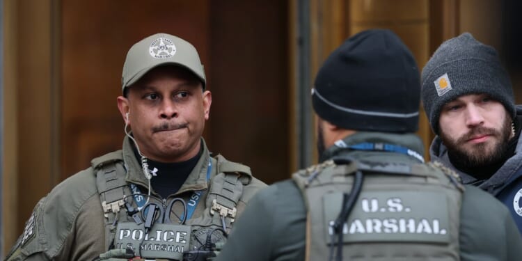 U.S. law enforcement officials stand guard outside of Daniel Patrick Moynihan United States Courthouse on Jan. 5, 2026, in New York City.