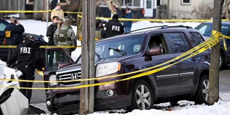 Members of law enforcement work the scene following a suspected shooting by an ICE agent during federal law enforcement operations on Jan. 7, 2026, in Minneapolis, Minnesota.
