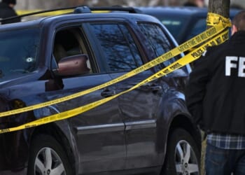 A bullet hole is in the windshield of a car from a shooting involving an ICE officer on Jan. 7, 2025 in Minneapolis.