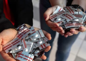 Polish pro-abortion activist Justyna Wydrzynska of the "Abortion Dream Team" women's rights group and Manon Aubry from La France Insoumise present abortion pills donated by representatives of LFI for Poland's first activist-run abortion consultation point in Warsaw, Poland, on April 29, 2025.