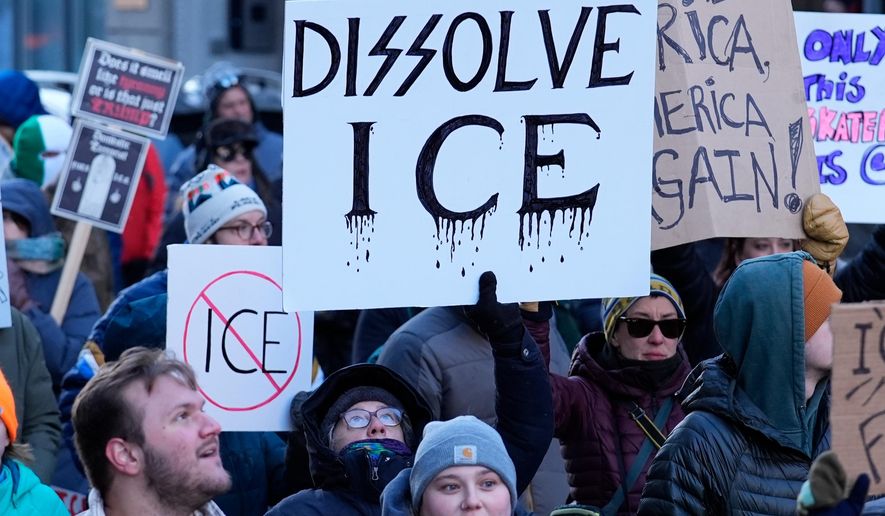 People protest against U.S. Immigrations and Customs enforcement in Portland, Maine, Friday, Jan. 30, 2026. (AP Photo/Robert F. Bukaty)