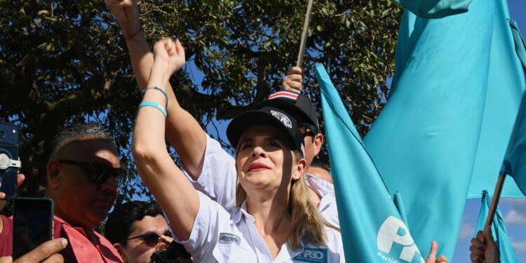 Voters in Costa Rica head to polls to decide outgoing president's conservative populist program