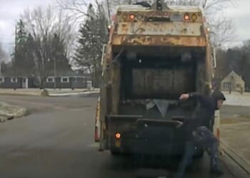 Ohio sanitation worker surprised to find police suspect in trash can