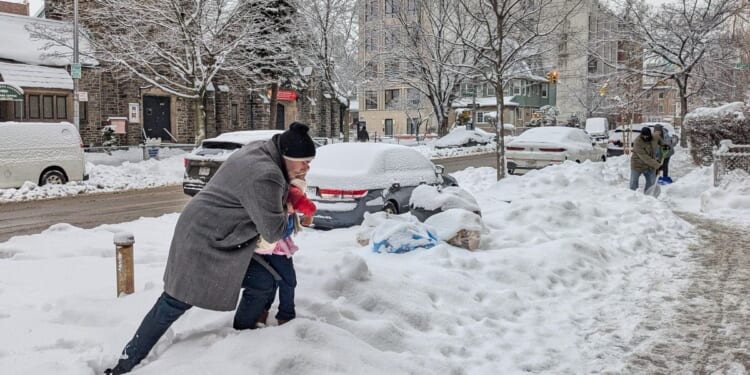 More snow falling on the Northeast U.S., where huge piles remain from the last storm