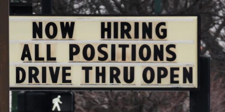 Filings for jobless aid rise modestly to 212,000 as layoffs remain at historically healthy levels