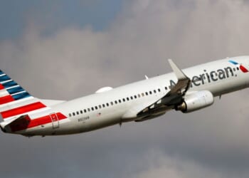 An American Airlines Boeing 737-800 takes off from Miami International Airport in a file photo dated Dec. 10, 2021. An American Airlines crew found a bullet hole in a similar plane after it landed in Colombia this week.