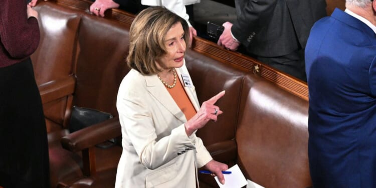 California Representative Nancy Pelosi arrives for President Donald Trump's State of the Union address in the House Chamber of the US Capitol in Washington, DC on Feb. 24, 2026.