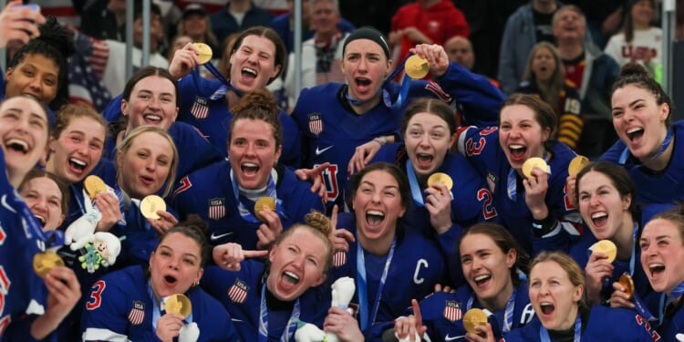 Gold medalist Team United States pose after the medal ceremony for the Ice Hockey Women following the Women's Gold Medal match between the United States and Canada on day 13 of the Milano Cortina 2026 Winter Olympic games at Milano Santagiulia Ice Hockey Arena on Feb. 19, 2026, in Milan, Italy.