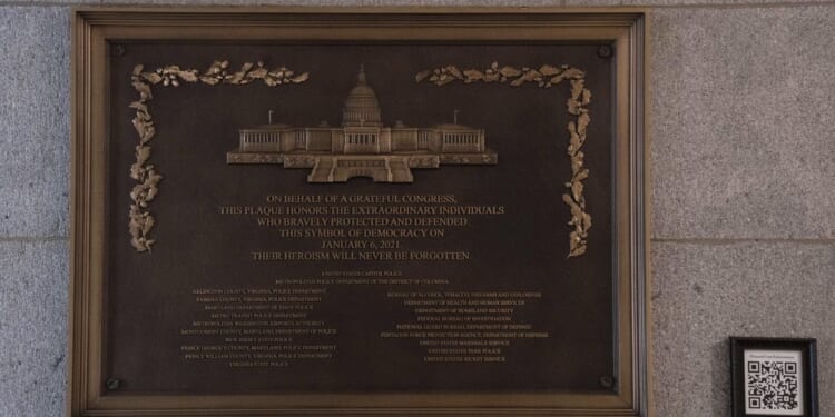 Jan. 6 plaque honoring police officers is installed at the Capitol after a 3-year delay