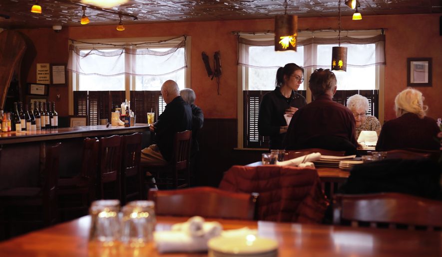 Diners eat at Barkeaters Restaurant on Tuesday, March 3, 2026 in Shelburne, Vt. (AP Photo/Amanda Swinhart)